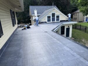 Inspecting a finished rubber roof over a sunroom in Walpole, MA